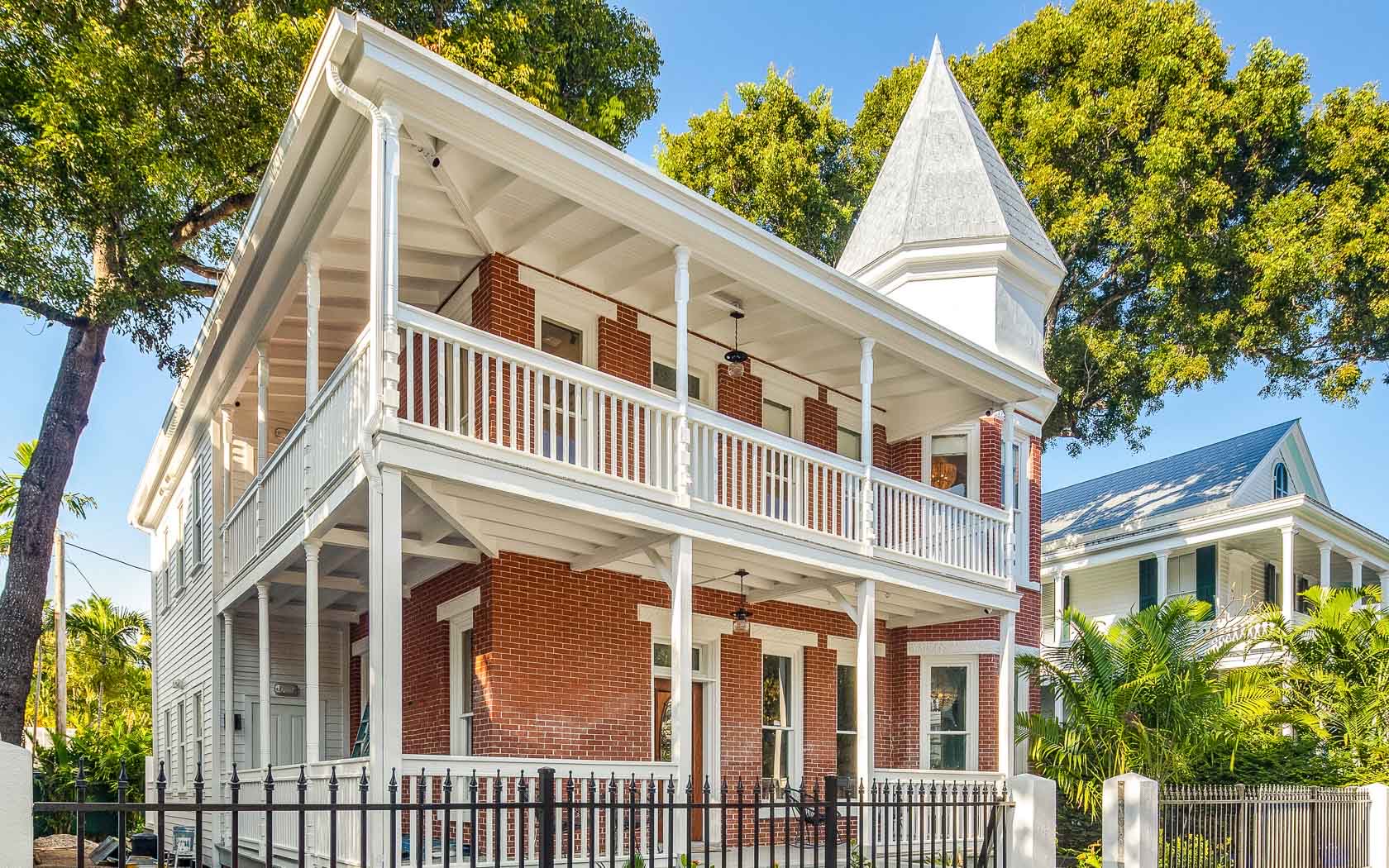 The historic red-brick Grand Maloney Hotel and wrap-around porches